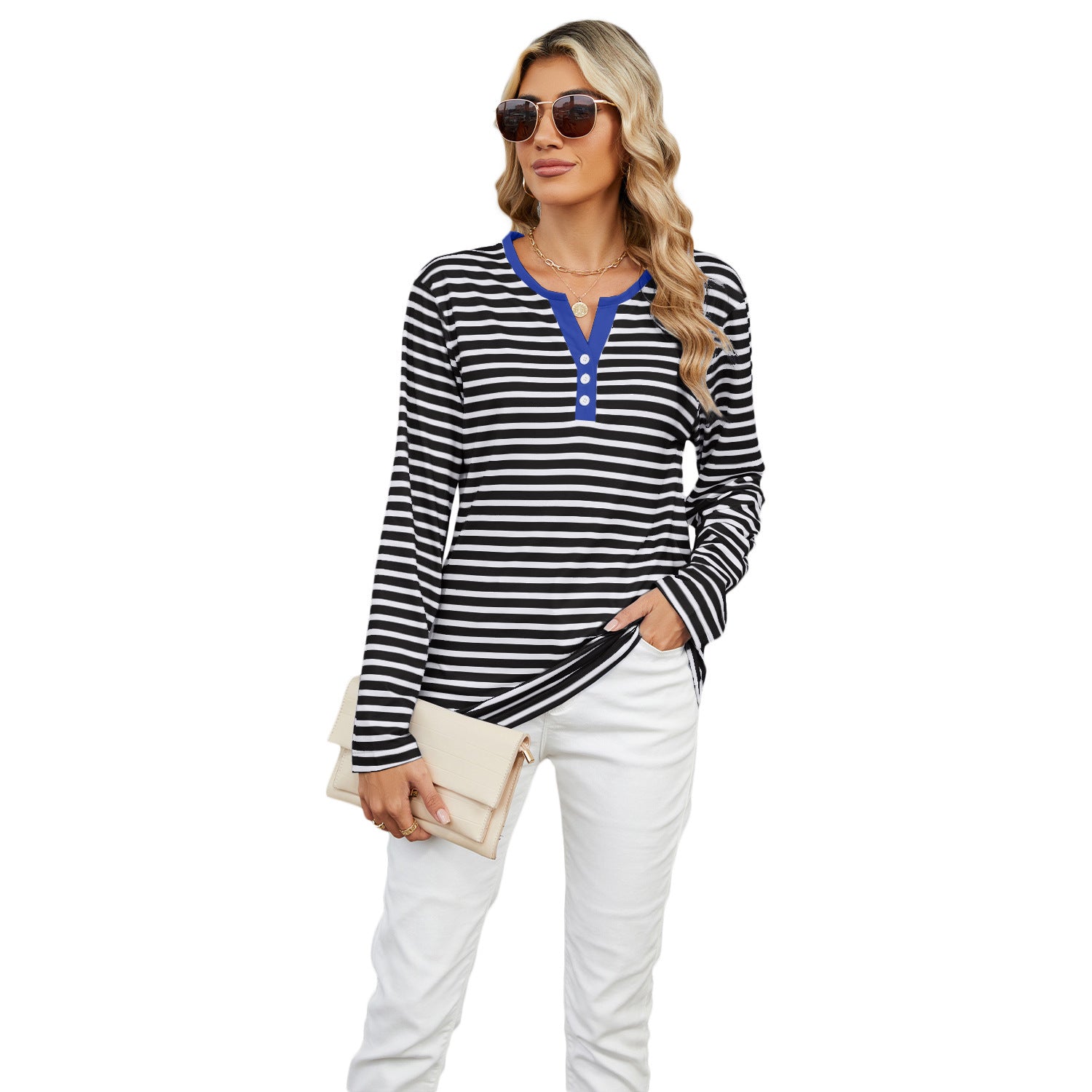 A vibrant red and white Striped V-neck T-shirt styled with denim jeans, perfect for a chic, casual weekend look.