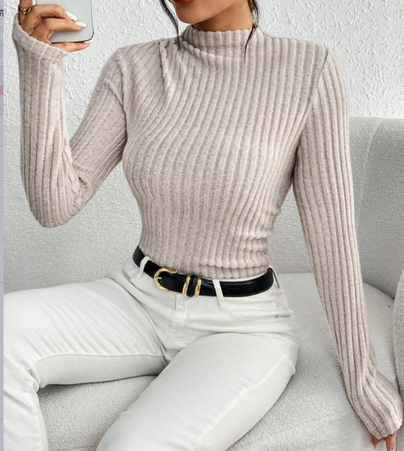Casual-chic look featuring ribbed bodysuit styled with boots
