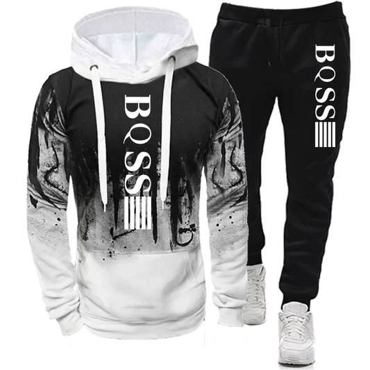"polyester splash ink tracksuit set for men full sleeve hoodie and tapered pants perfect for flights and long road trips"