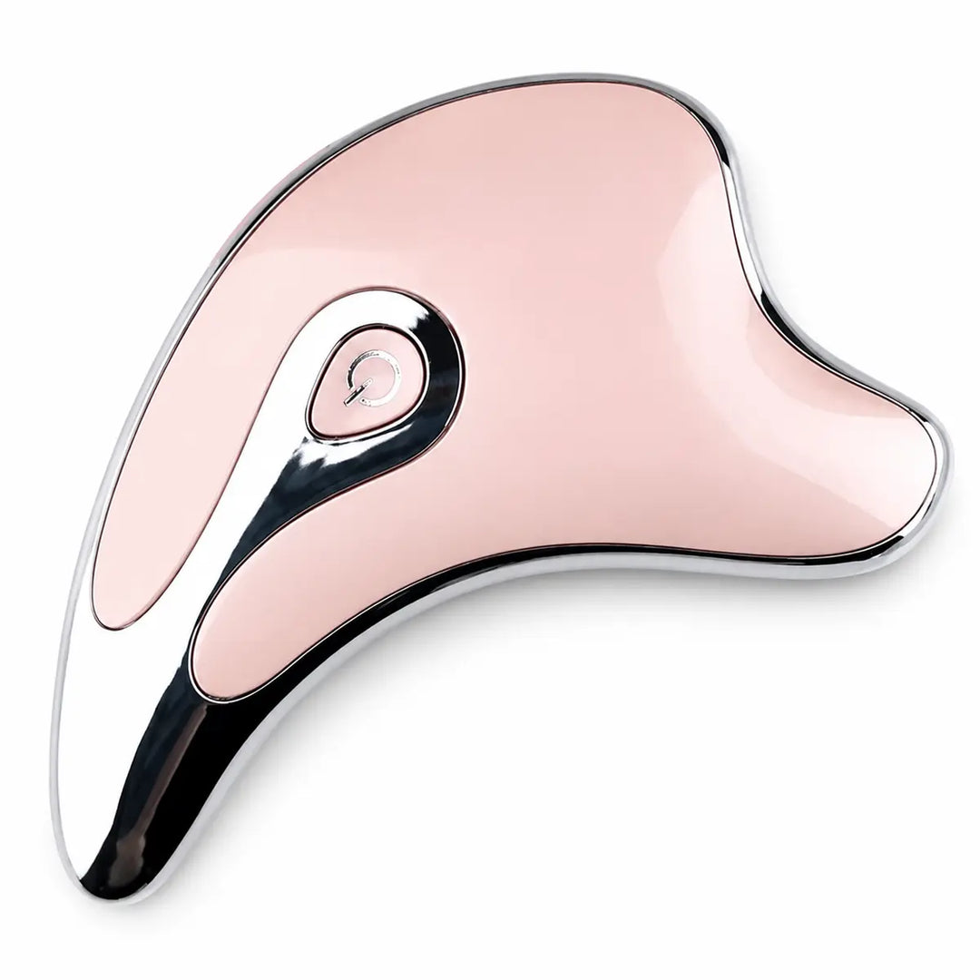 Pink electric gua sha massager on a white studio background, showing its curved shape, chrome trim and centered power button.