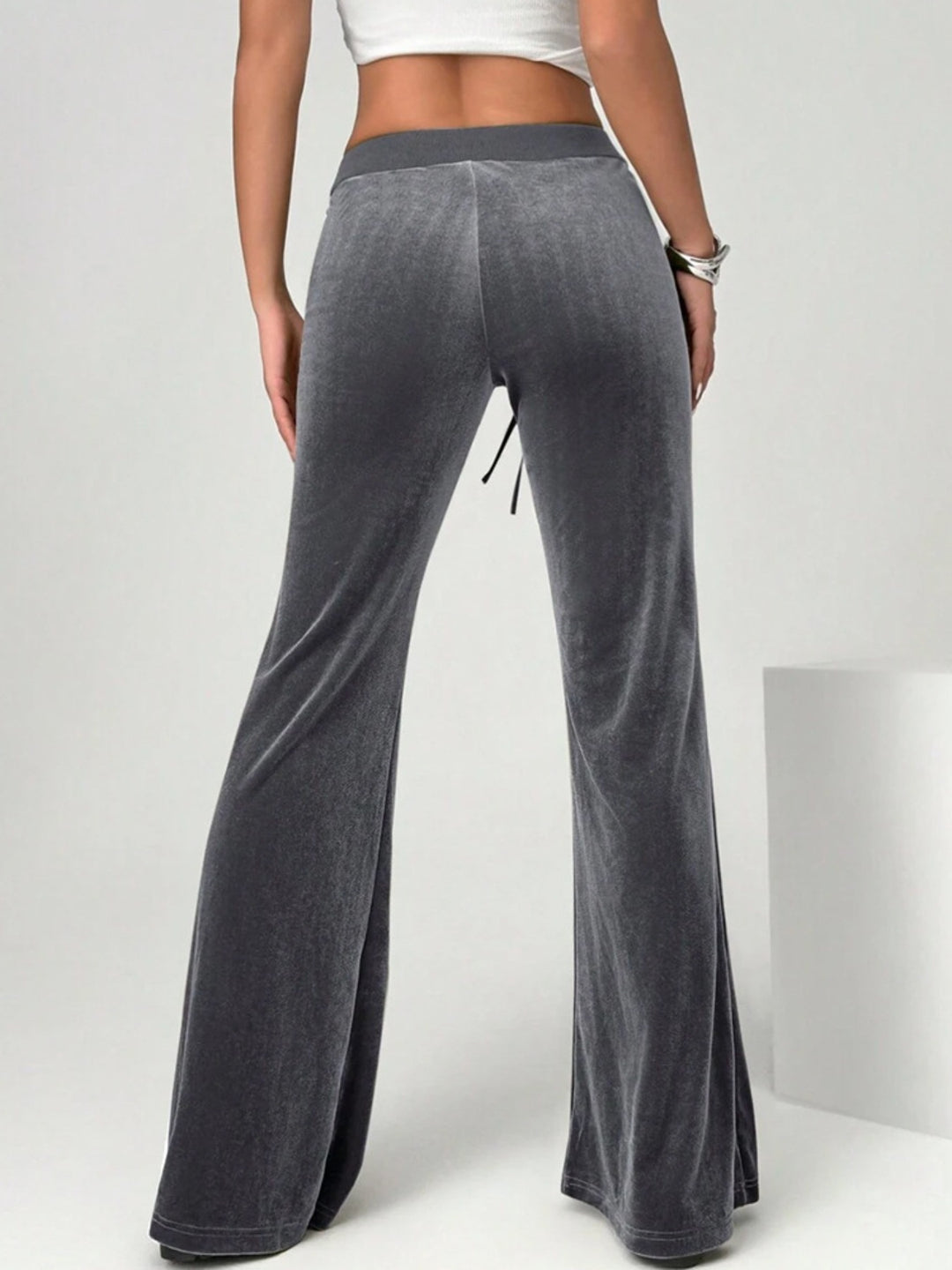 velvet flare pants styled with fitted top smart casual office context