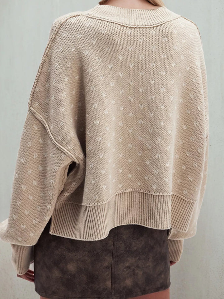 "heart pattern sweater women’s style shown from back, ribbed hem and cuffs with repeated heart motifs for chic casual look"