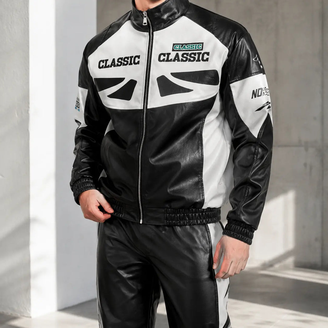Black colourblock zip-up jacket lifestyle view shown on a model with contrast white panels and graphic printed front details.