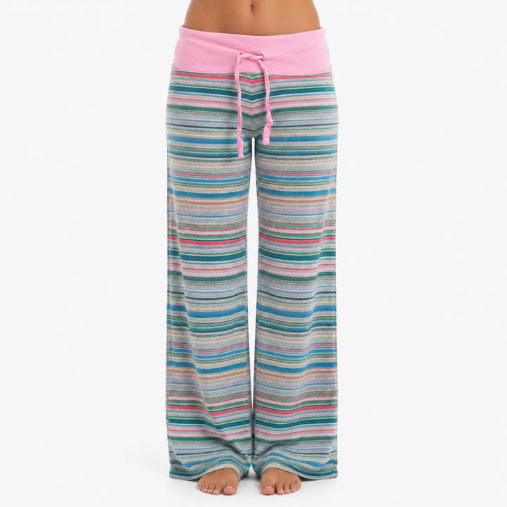 Pink striped wide leg pants shown from the front on model, with fold-over waistband, center drawstring and full-length shape.