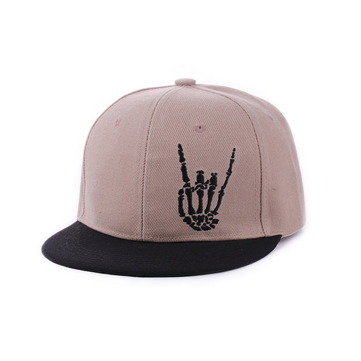 Retro hip hop baseball cap in khaki photographed against brick wall street style setting
