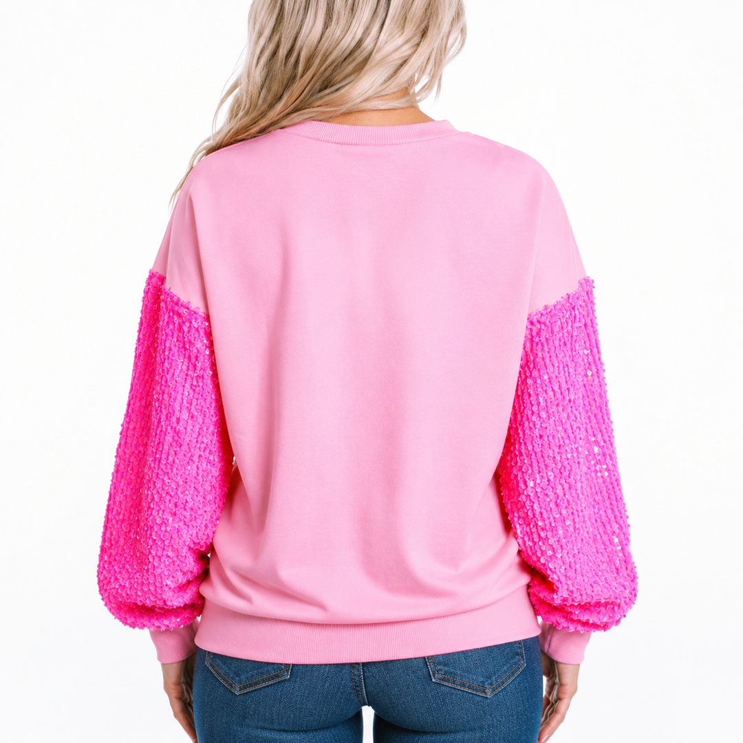 Back view of pink drop shoulder sweatshirt with full sequin sleeves