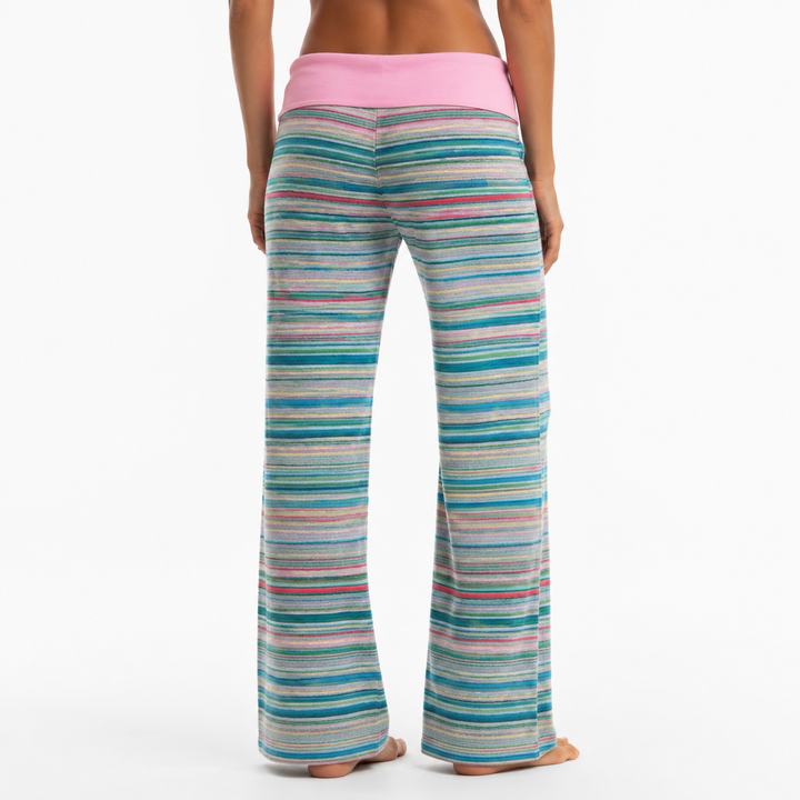 Back studio view of Pink striped pants on a model, showing stripe continuity, wide leg silhouette and waistband construction.