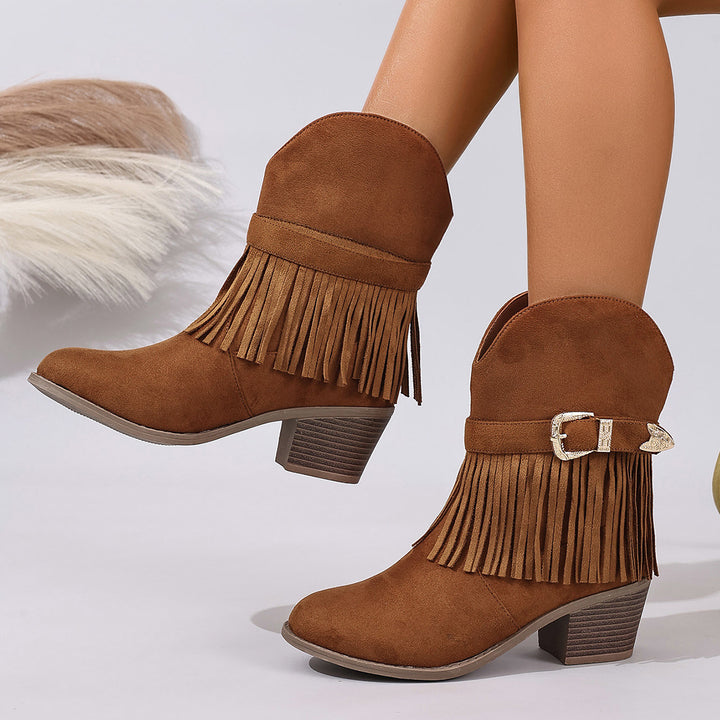Pink suede western ankle boots with fringe detail, round toe and low heel, shown for product detail reference product detail.