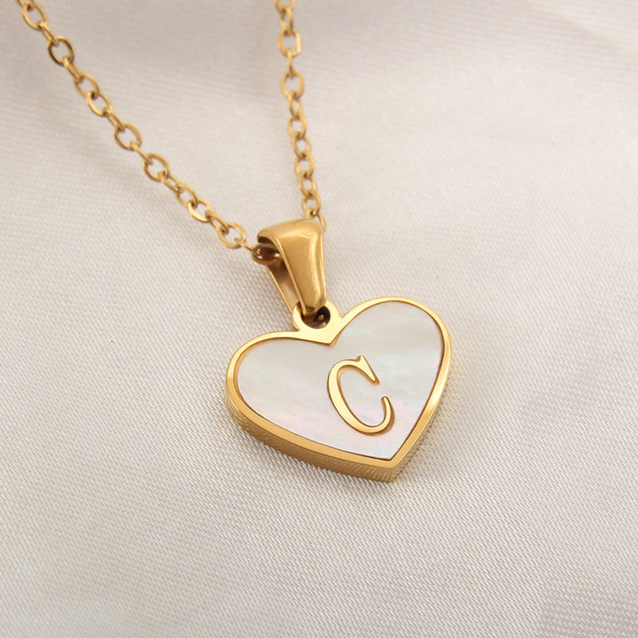 Heart letter chain necklace with alphabet options A to Z, stainless steel material and gold-plated finish - Online reference.