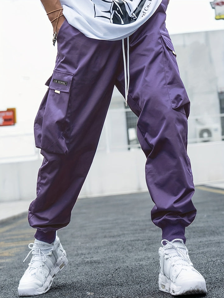 Purple cargo pants worn by a person with a blurred background
