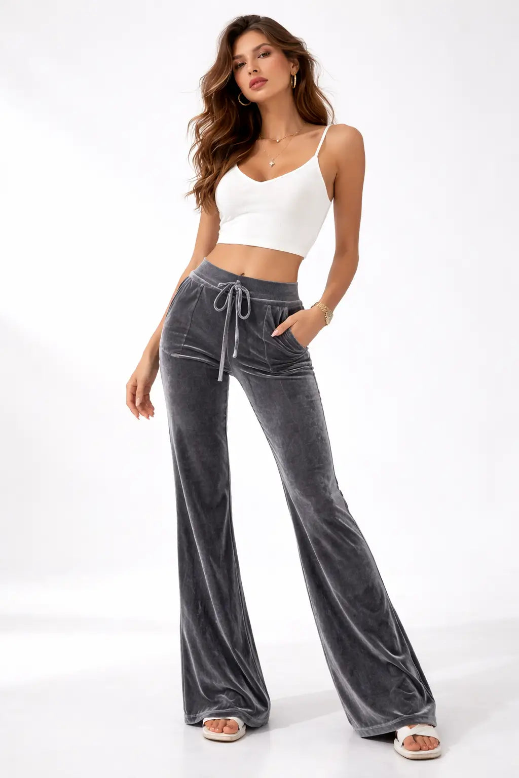 velvet flare pants flared hem silhouette paired with heels evening context