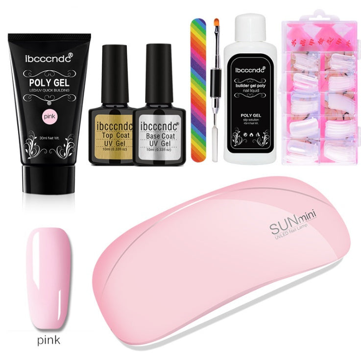Collection of nail care products including gel polish, a lamp, and accessories on a white background.