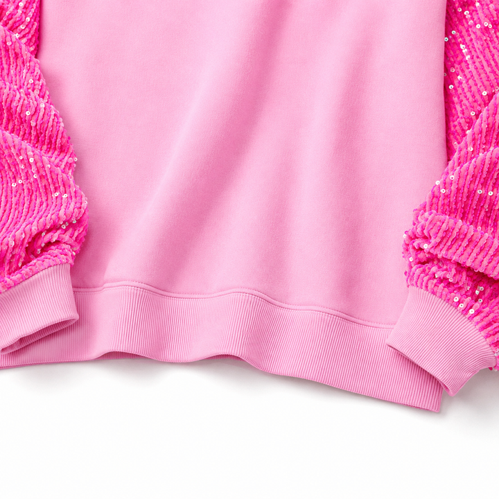 Pink ribbed hem, clean seams and sequin sleeve construction detail