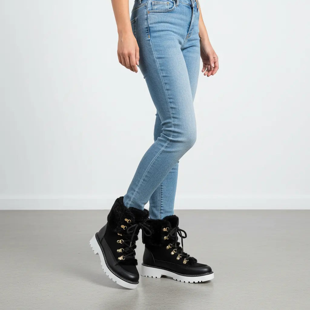 cozy winter boots lace-up style beige suede fuzzy trim worn with black jeans lifestyle shot
