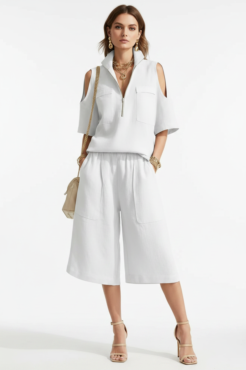 Model stands in a soft neutral studio, styled in the matching summer two-piece with 3D pockets 