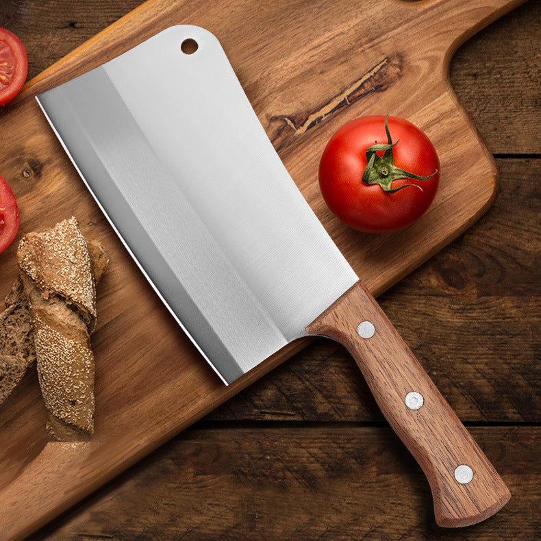 modern stainless steel kitchen knife flat lay with soft shadows and neutral tones