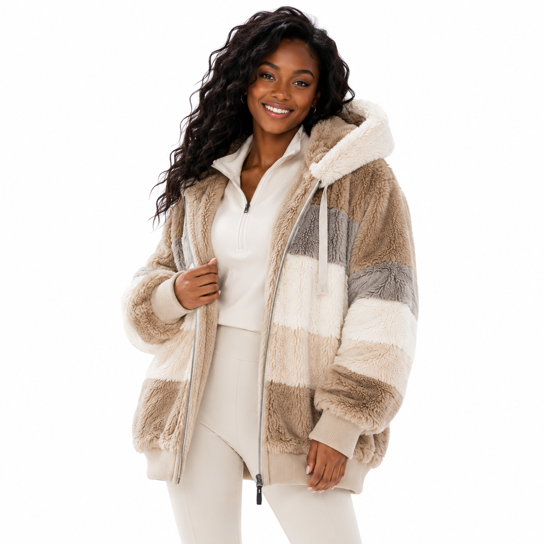 Women’s fuzzy zip up sweater styled as casual outerwear with hood, pockets and comfortable polyester spandex blend.