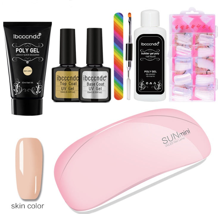 Collection of nail care products including gel polish, a lamp, and accessories on a white background.