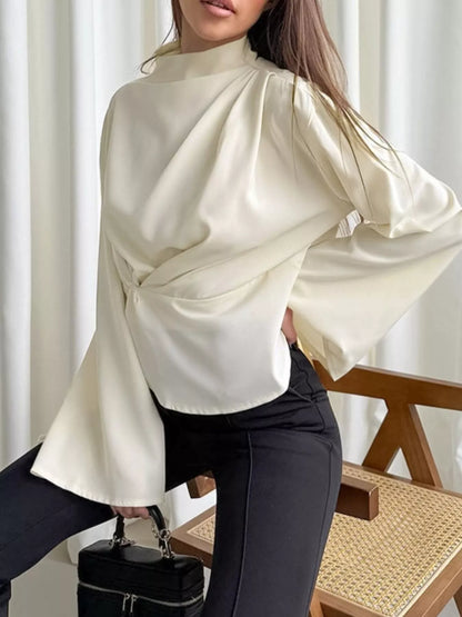 Going out ruched top mock neck blouse paired with satin skirt evening outfit look sleek long sleeves and ruching

