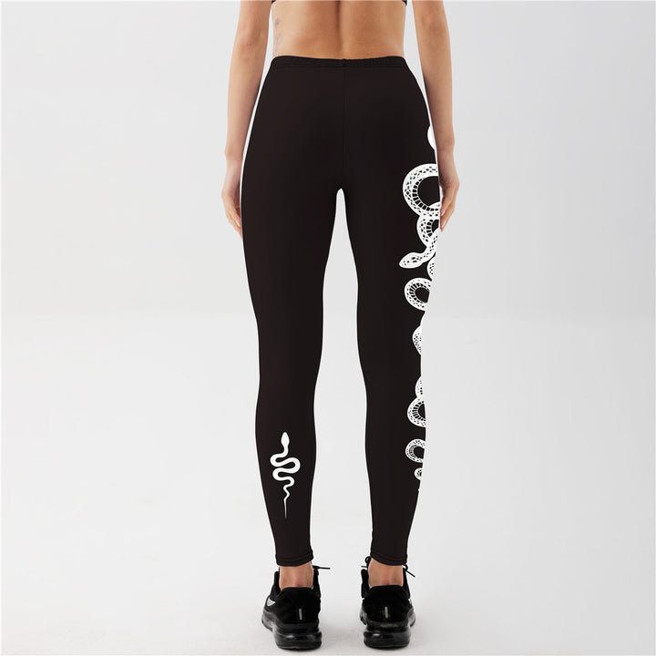 "Edgy snake and moon printed leggings in black, body hugging yoga tights for festival, streetwear and workout looks"