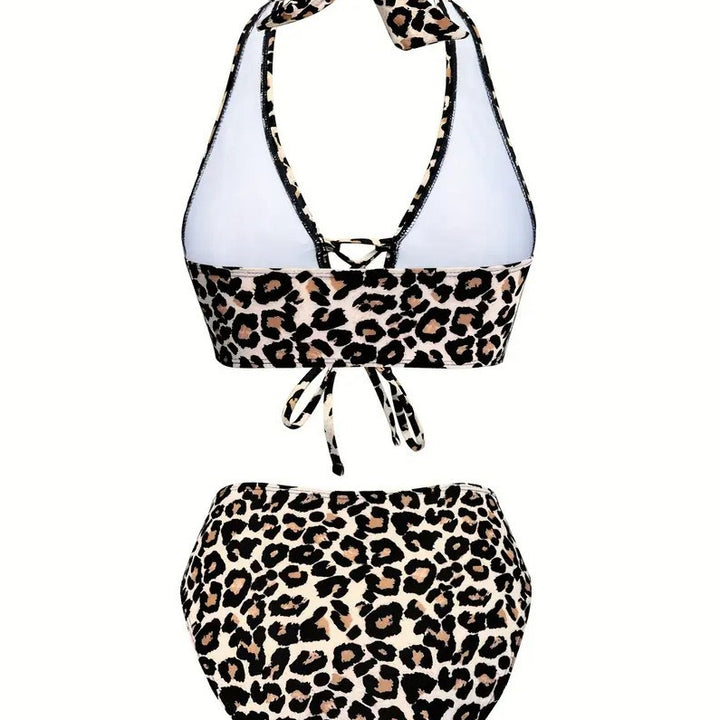 Model wearing a leopard high waist bikini by the pool in bright summer light
