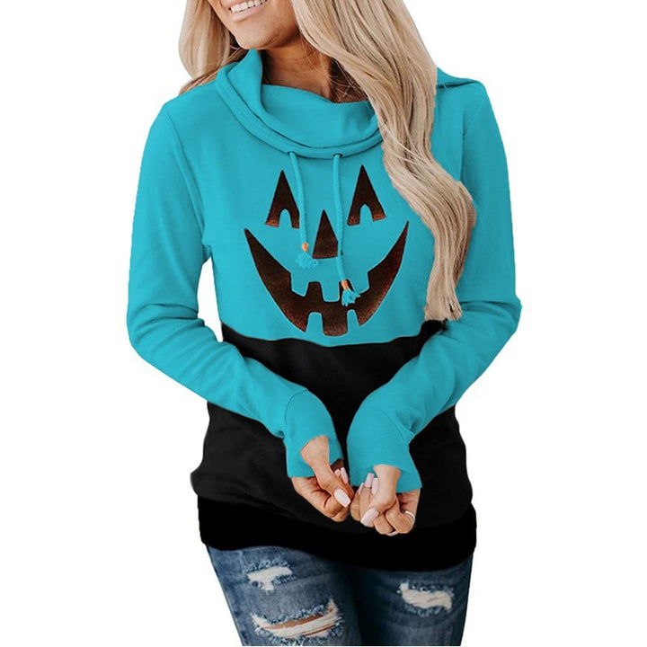 Supplier photo of a turquoise blue and black pullover with a pumpkin face graphic, long sleeves and folded drawstring collar.