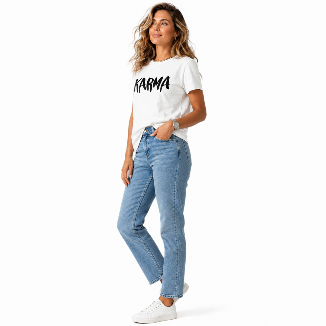 Casual white Karma T-shirt for women, shown with jeans, short sleeves, loose fit, and bold printed front lettering for style.