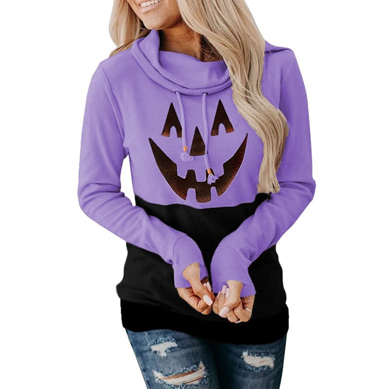 Supplier photo of a lavender purple and black pullover with a pumpkin face graphic, long sleeves and folded drawstring collar