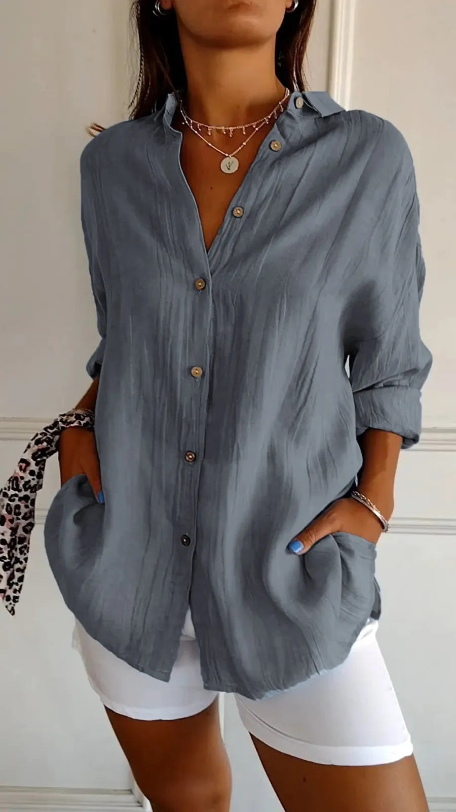 long sleeve pleated shirt flat lay showing solid color button-up with pleated design and long sleeves for commute