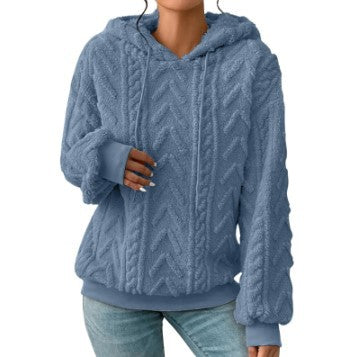 Blue textured hoodie on a model, shown from the front. The textured fabric is shown in the pictured style and garment design.