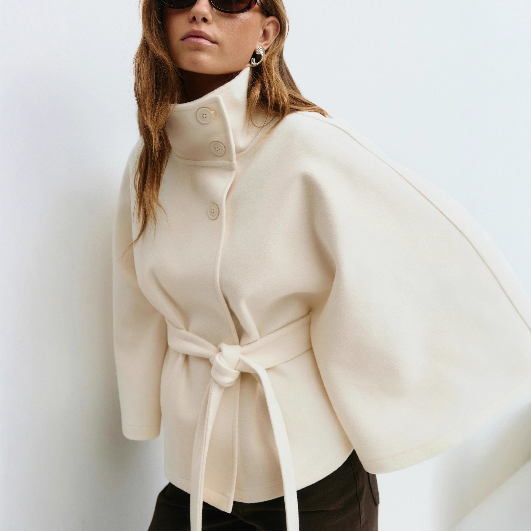 "lightweight trench coat women neutral apricot tone stand collar clean lines perfect for quiet luxury wardrobe"