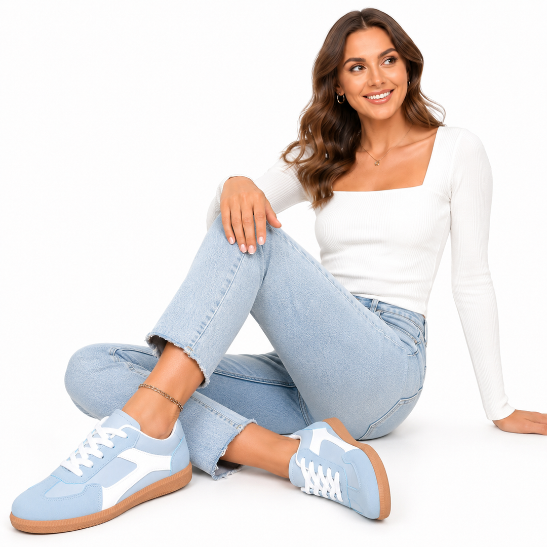 Lightweight women’s sneakers with round toe, front laces, and rubber gum outsole