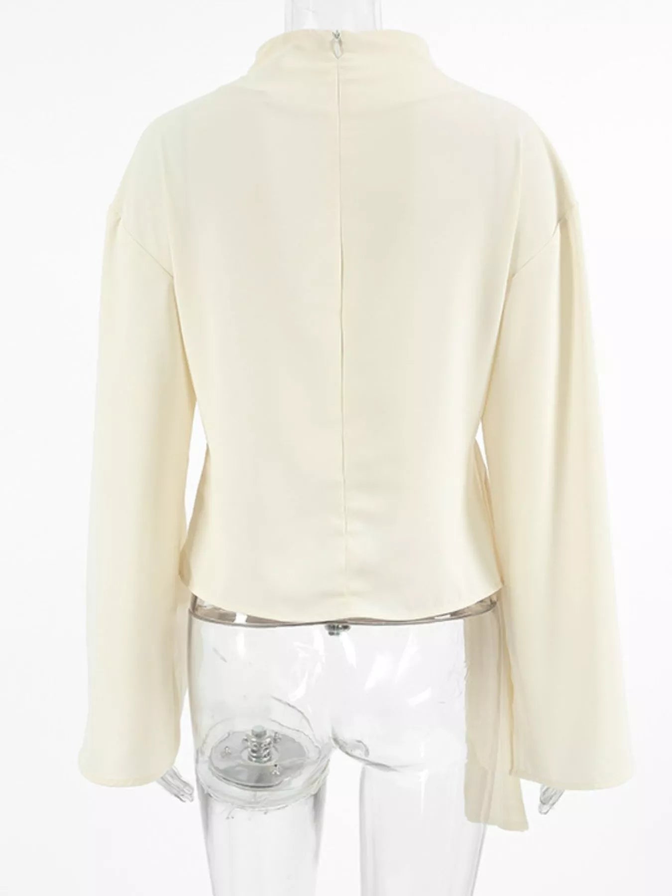 Asymmetrical ruched top ruched mock neck blouse styled under blazer for office to night layered outfit look
