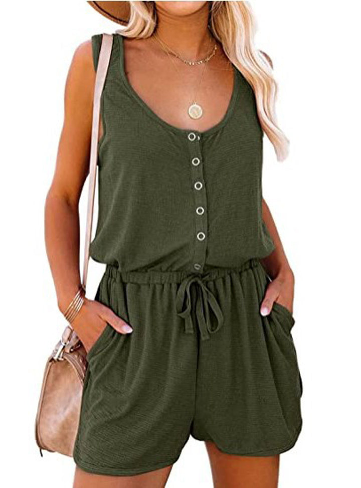 Woman wearing a green romper with a white background