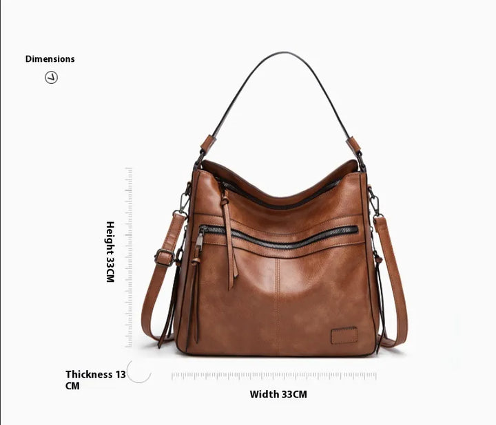 Front product view of zippered tote bag with structured everyday shape
