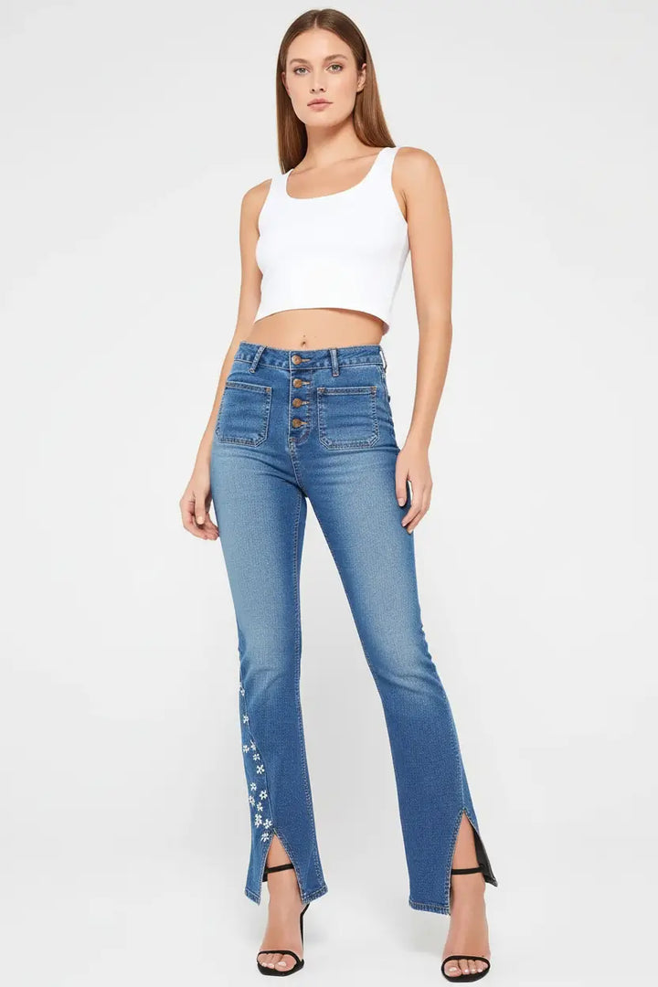 women’s high waist star patch jeans full length drape flowing over platform sneakers city street context