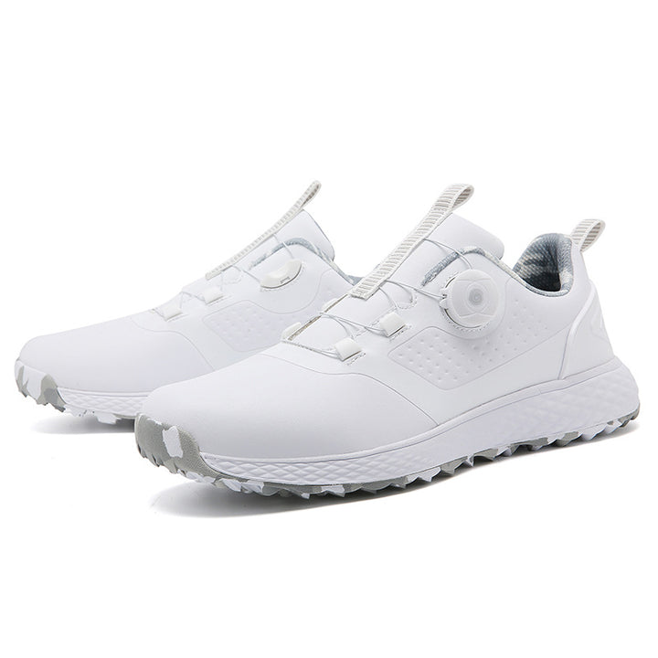 White rotary buckle footwear displayed as a pair on a white studio background, with the side fastening and low profile clear.