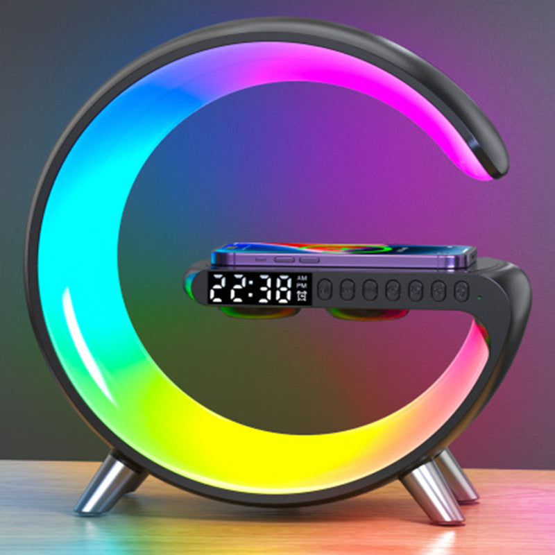 Smart bedside lamp with app-controlled ambient lighting, Bluetooth audio, wireless charging, clock display and alarm control.
