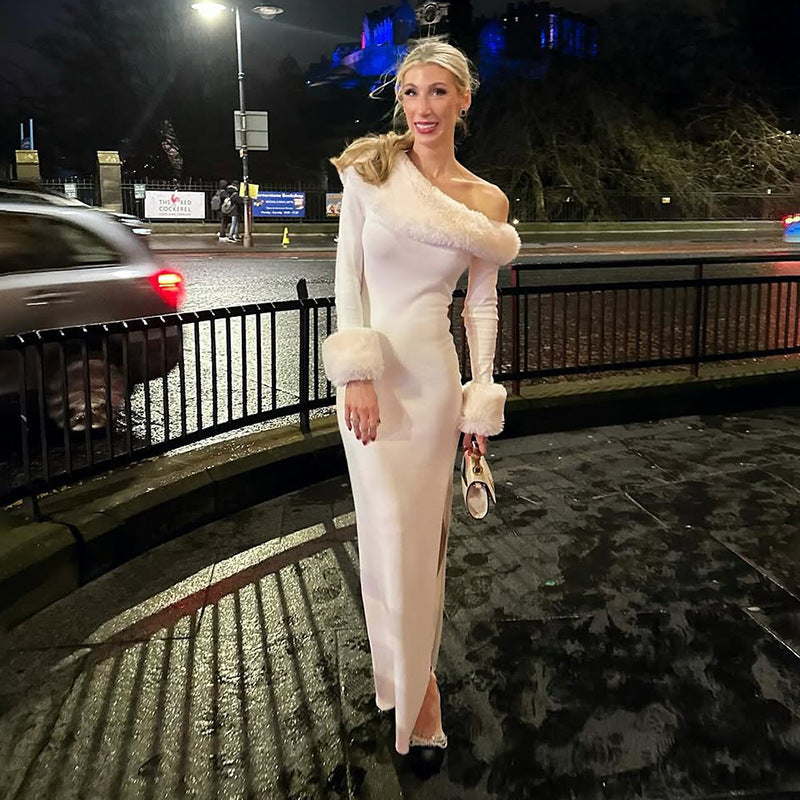 holiday party white dress white maxi with oblique collar and tailored feel, set in luxury lobby setting near staircase
