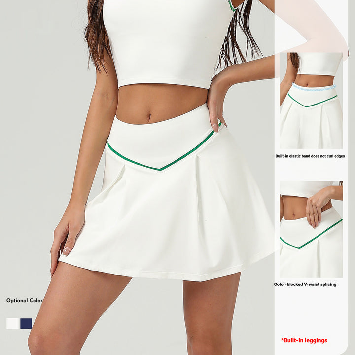 White skirt with green trim worn by a model on a plain background
