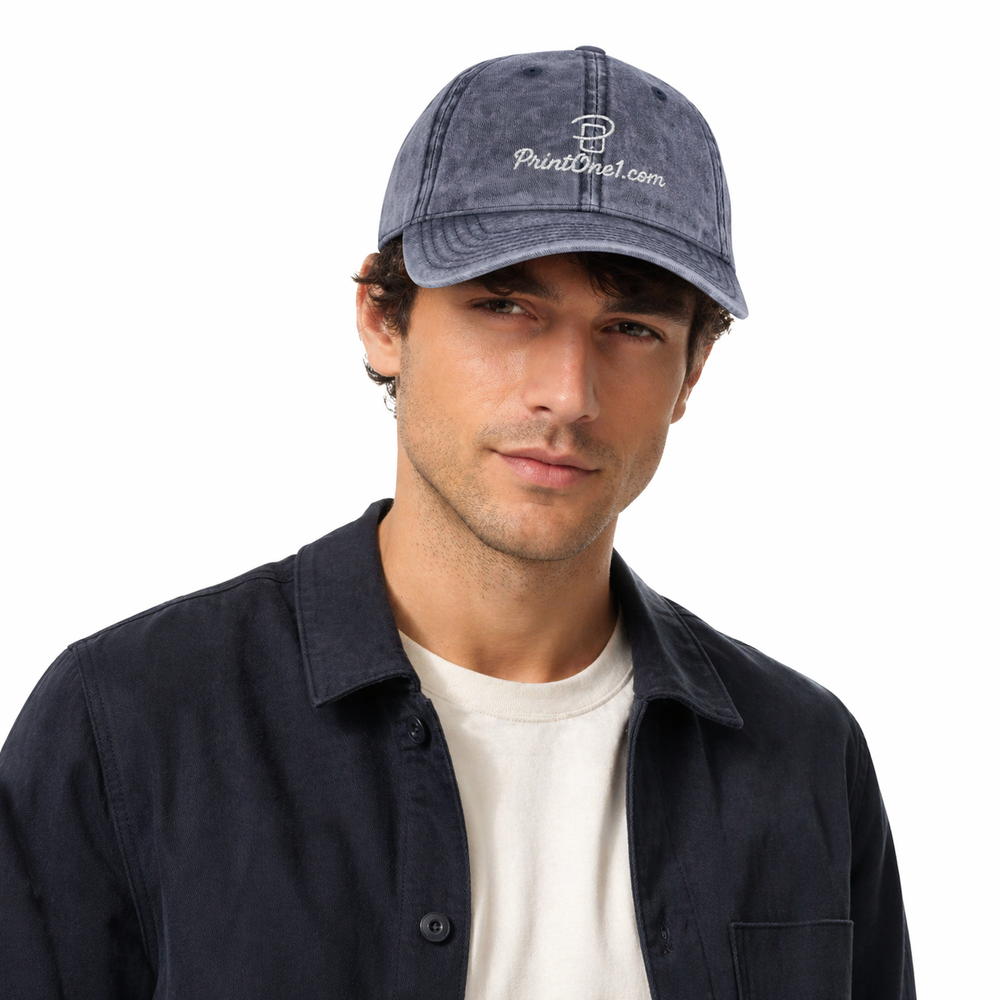 Model shot of streetwear cap paired with denim and a simple tee in an urban setting