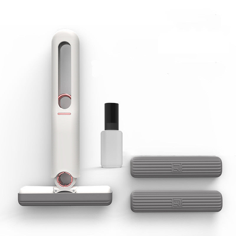 White handheld vacuum cleaner with attachments on a white background