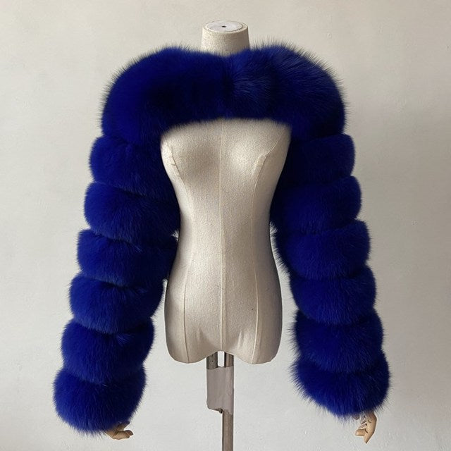 Faux fur bolero with long segmented sleeves on dress form