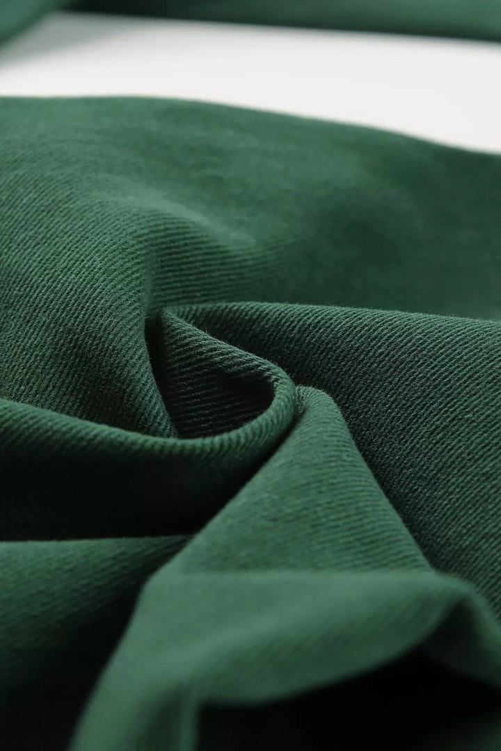 Close-up of dark green fabric texture