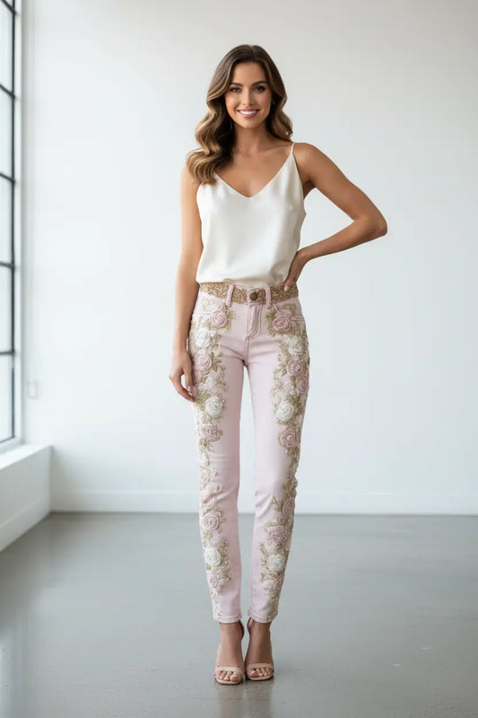 Pink rose embroidered jeans hem detail with stereo rose pattern, flared leg silhouette for elegant daily looks
