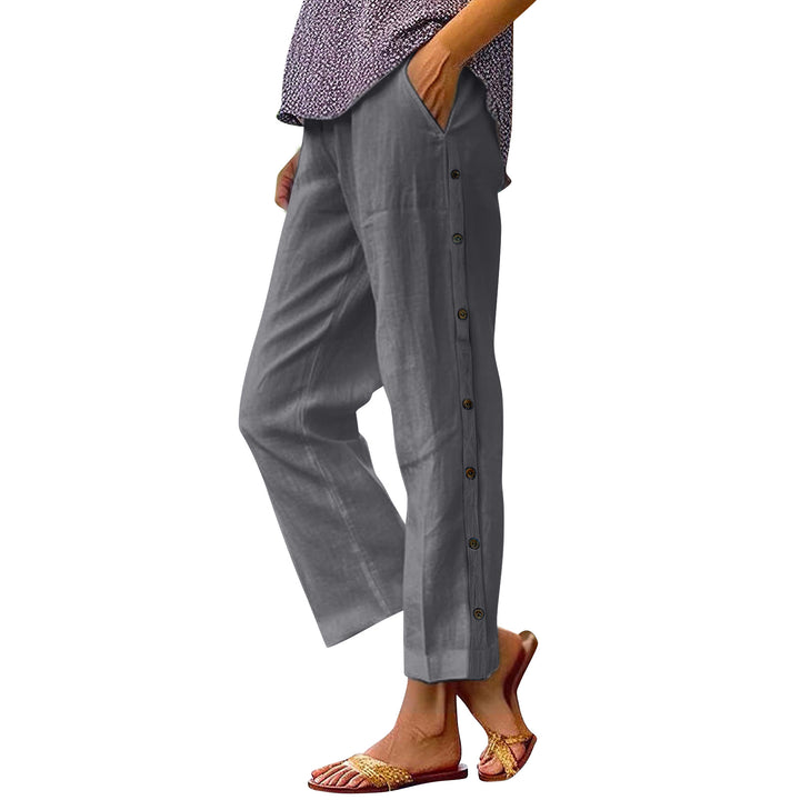 Gray button-up pants worn by a person on a white background