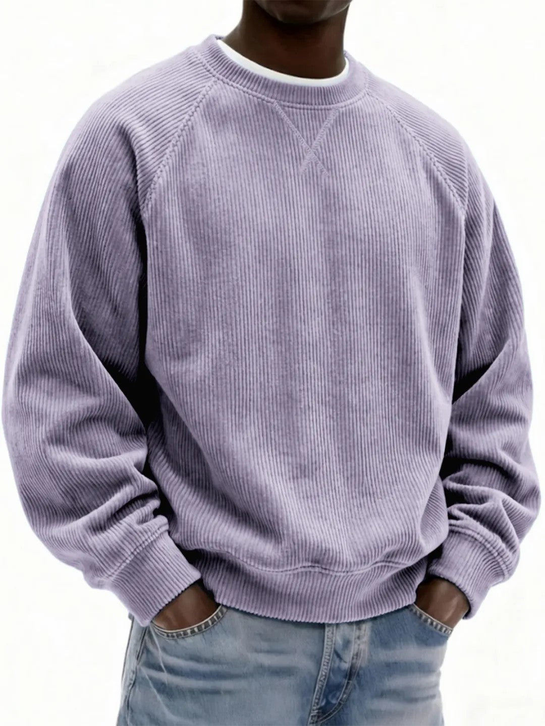 Person wearing a light purple corduroy sweatshirt on a white background