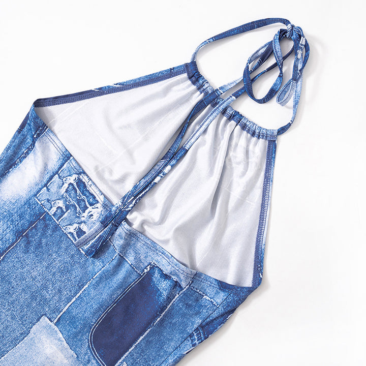 Three-quarter view of the blue halter dress showing the printed panels and short fitted silhouette.