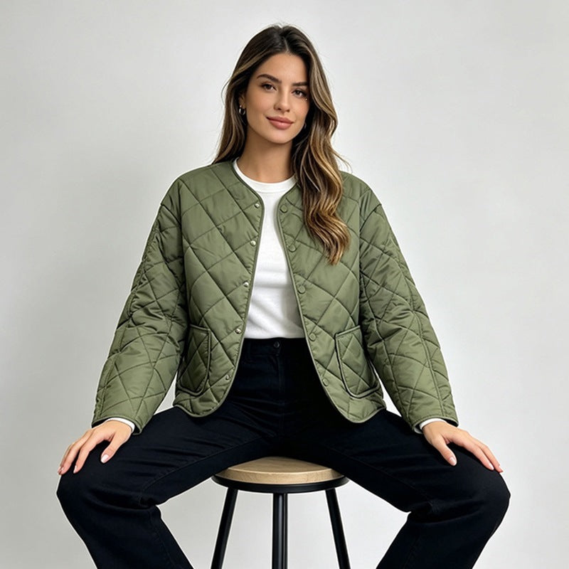 Green diamond-quilted jacket on a seated model