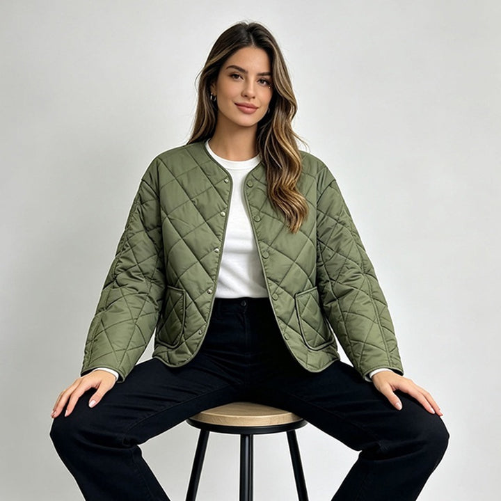 Green diamond-quilted jacket on a seated model